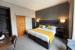 Square View Room with a queen sized bed at The Angus Hotel Blairgowrie