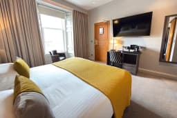 Square View Room with a queen sized bed at The Angus Hotel Blairgowrie